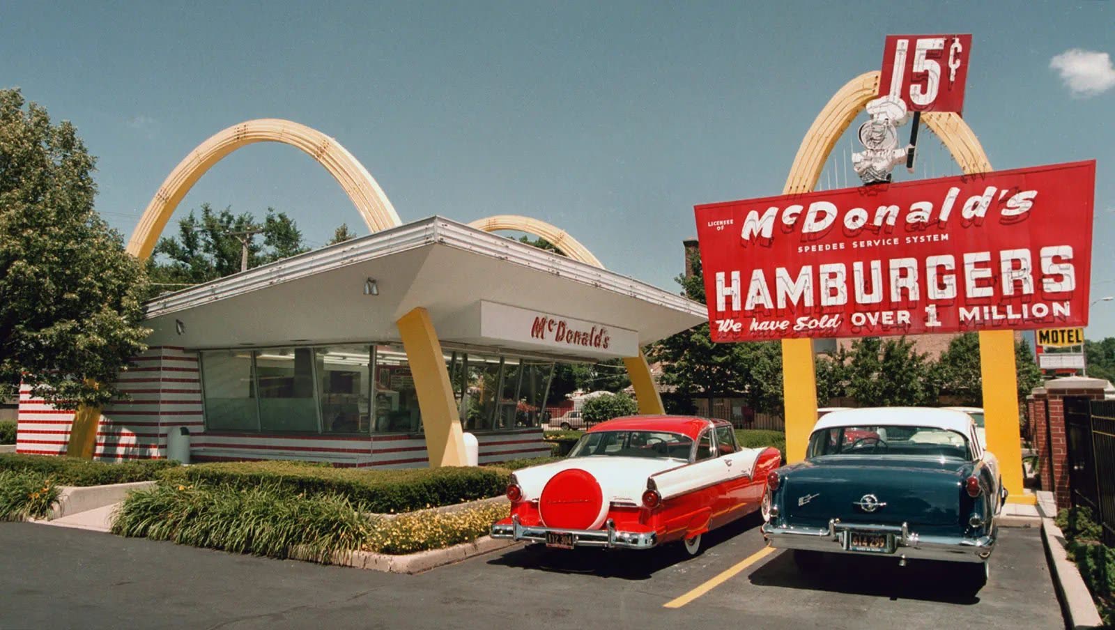 A classic 1950s McDonald’s drive-in with the original Golden Arches and Speedee sign