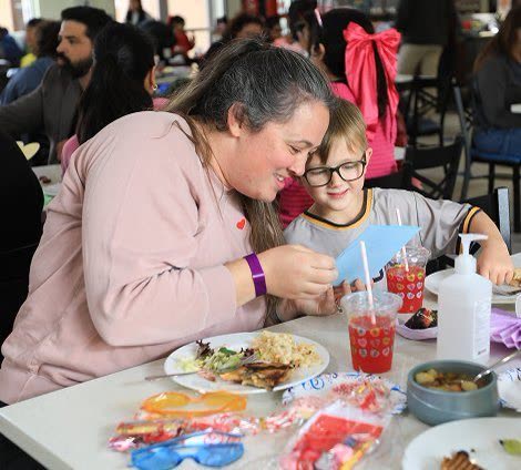 A mother and her young son sharing a quiet moment at a Ronald McDonald House